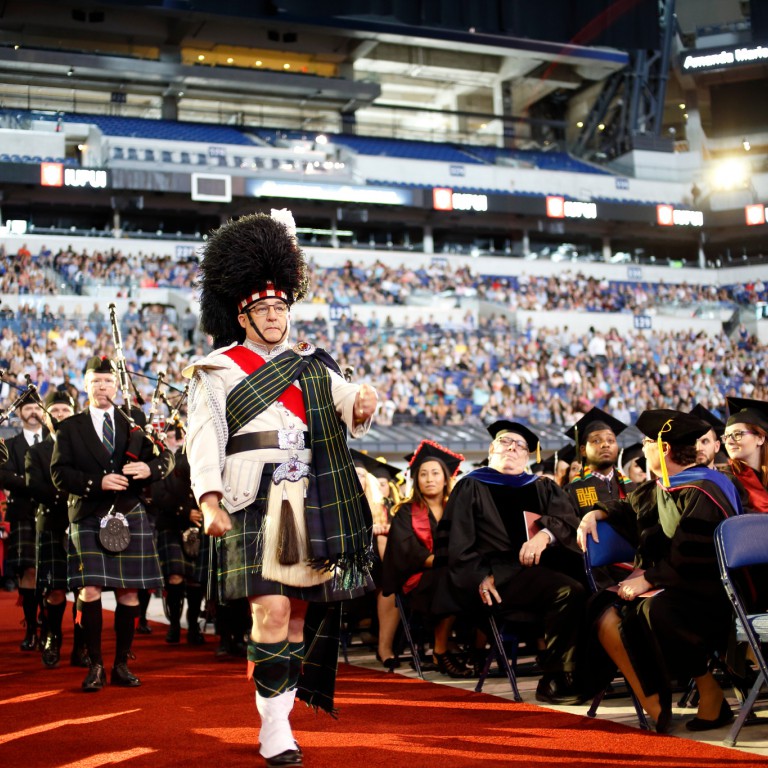 Scottish bagpipes help introduce Commencement.
