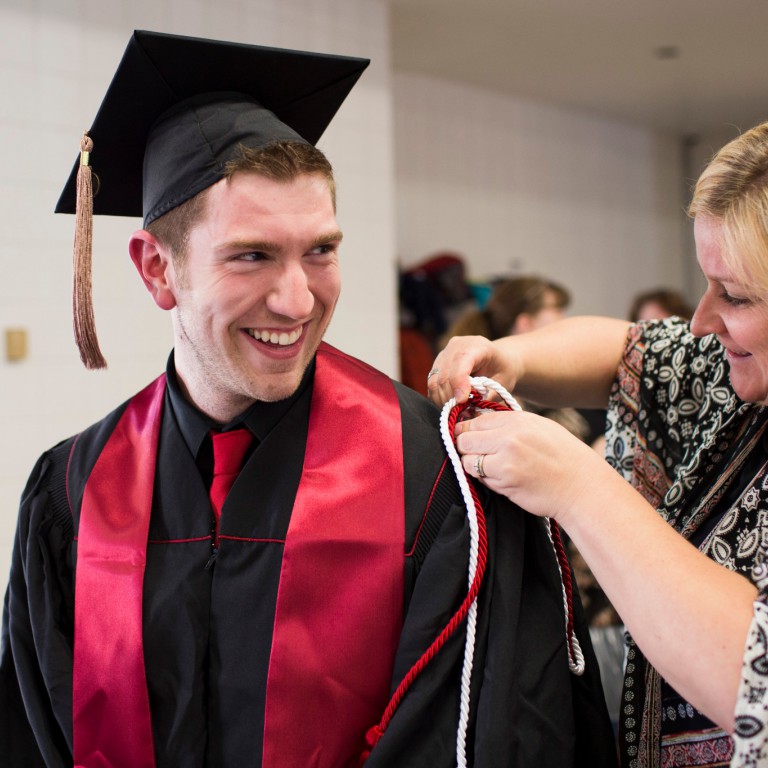 Graduate Justin Westfall prepares for the ceremony.