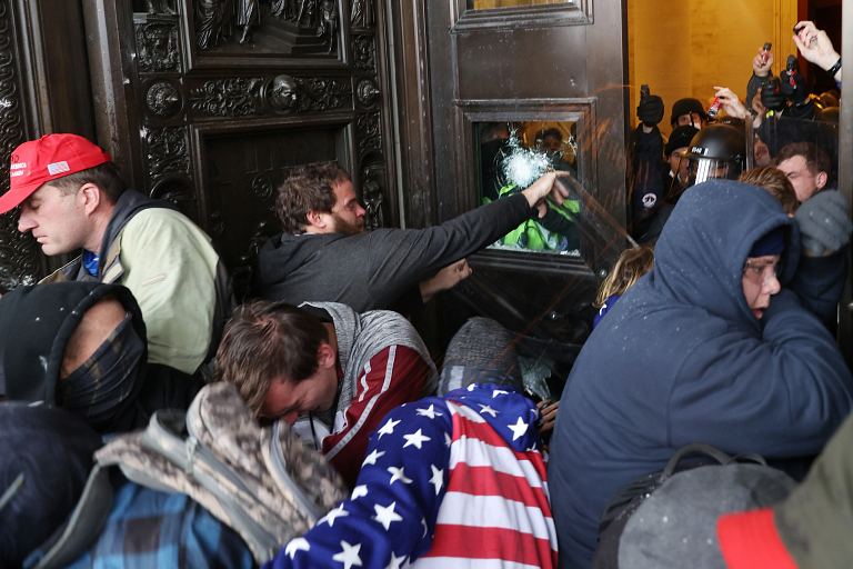 Protestors gather on the door of the U.S. Capitol