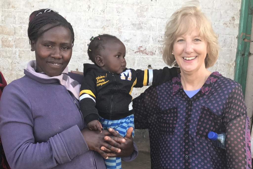 Debra Litzelman with a mother and child in Kenya