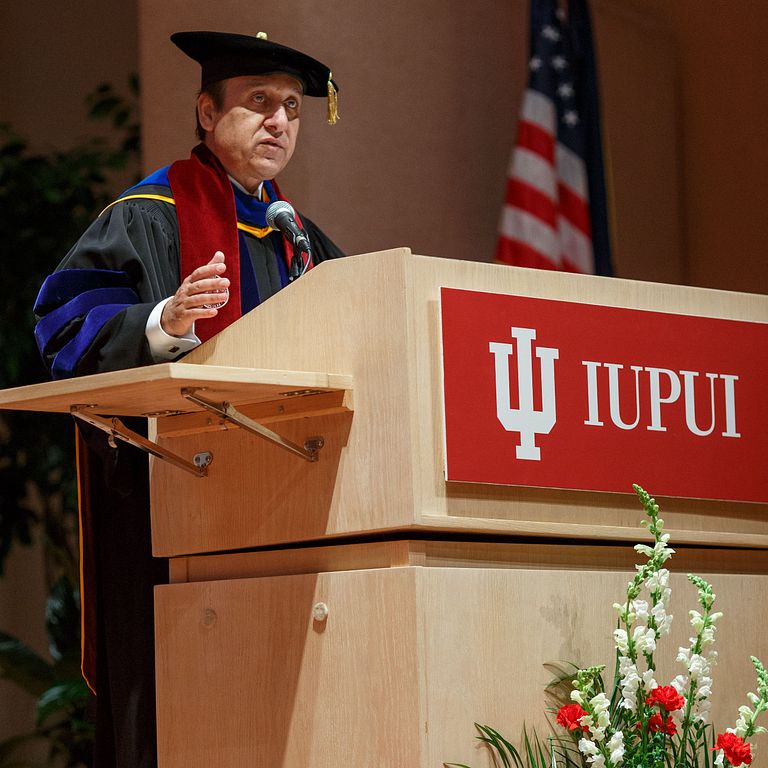 IUPUI Chancellor Nasser H. Paydar speaks at a podium