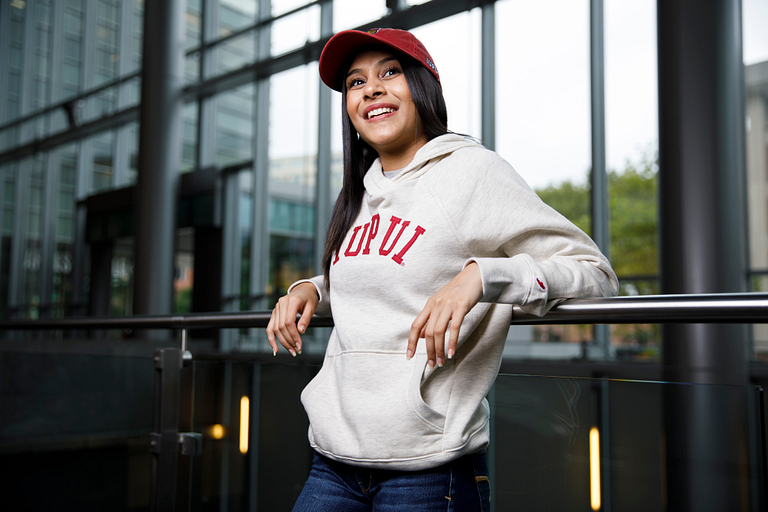 Naeema Patel models a new sweatshirt.