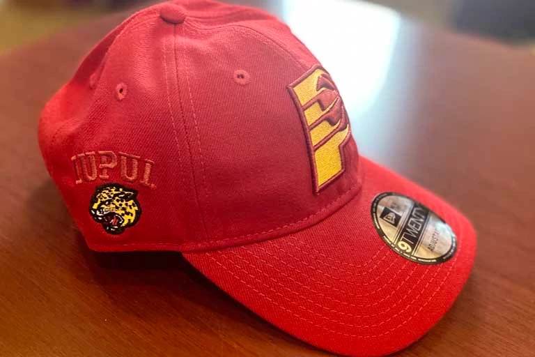 red Pacers hat with IUPUI logo on the side