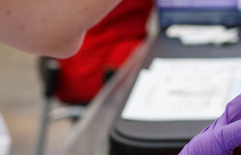 a student receives a flu shot 