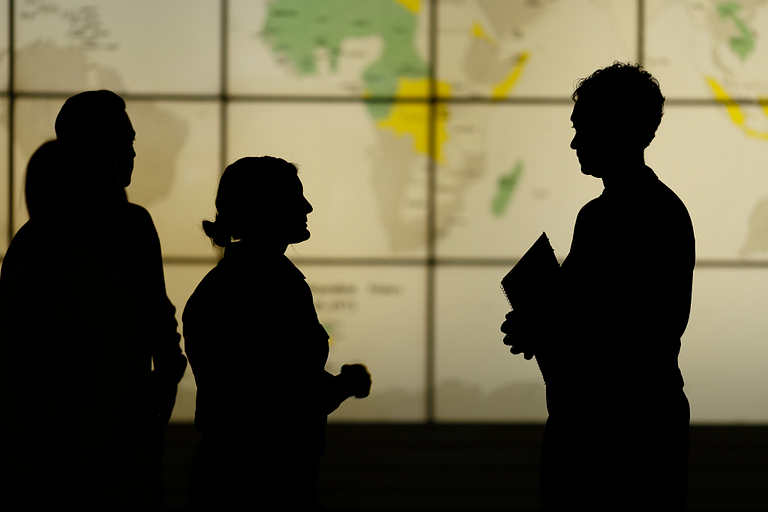 People in front of a map