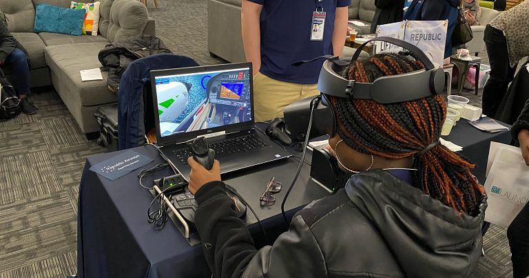 Conference attendee learns more about STEAM careers.