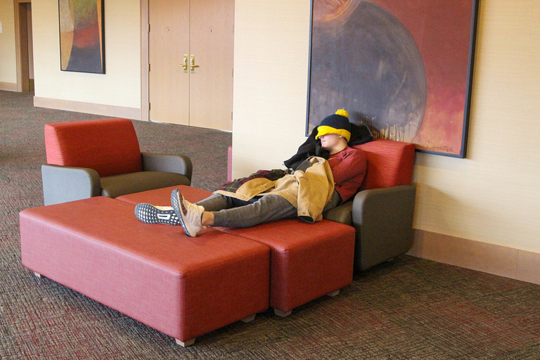 A student catches a nap in University Tower.