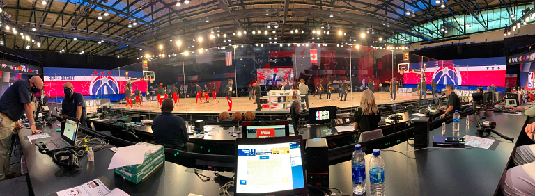 a panoramic view of the basketball court from the scorer's table
