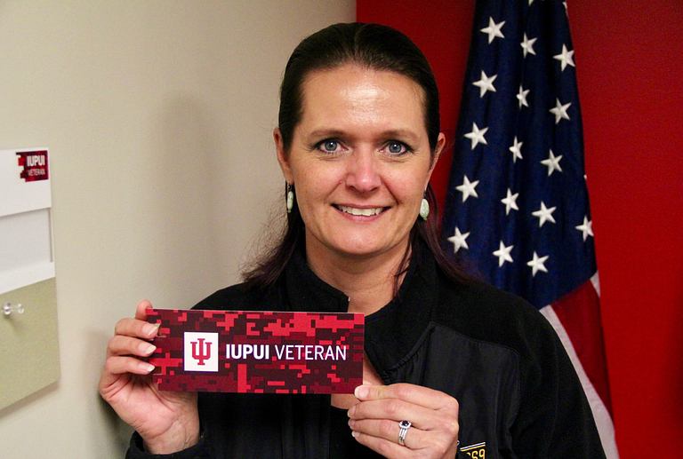 Kim Bloodgood holds a veteran bookmark.