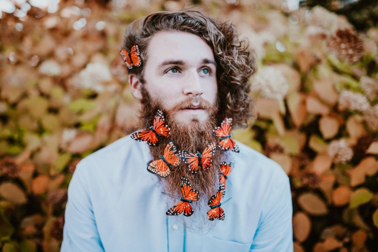 Joe Lange models with fake butterflies