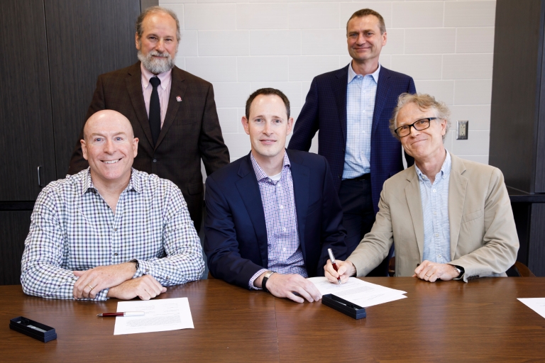 IU Optometry and CooperVision representatives sign agreement