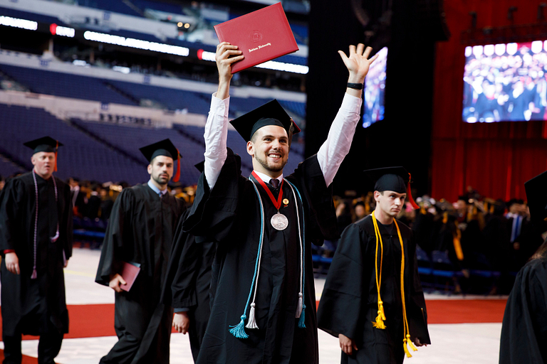 A graduate celebrates.