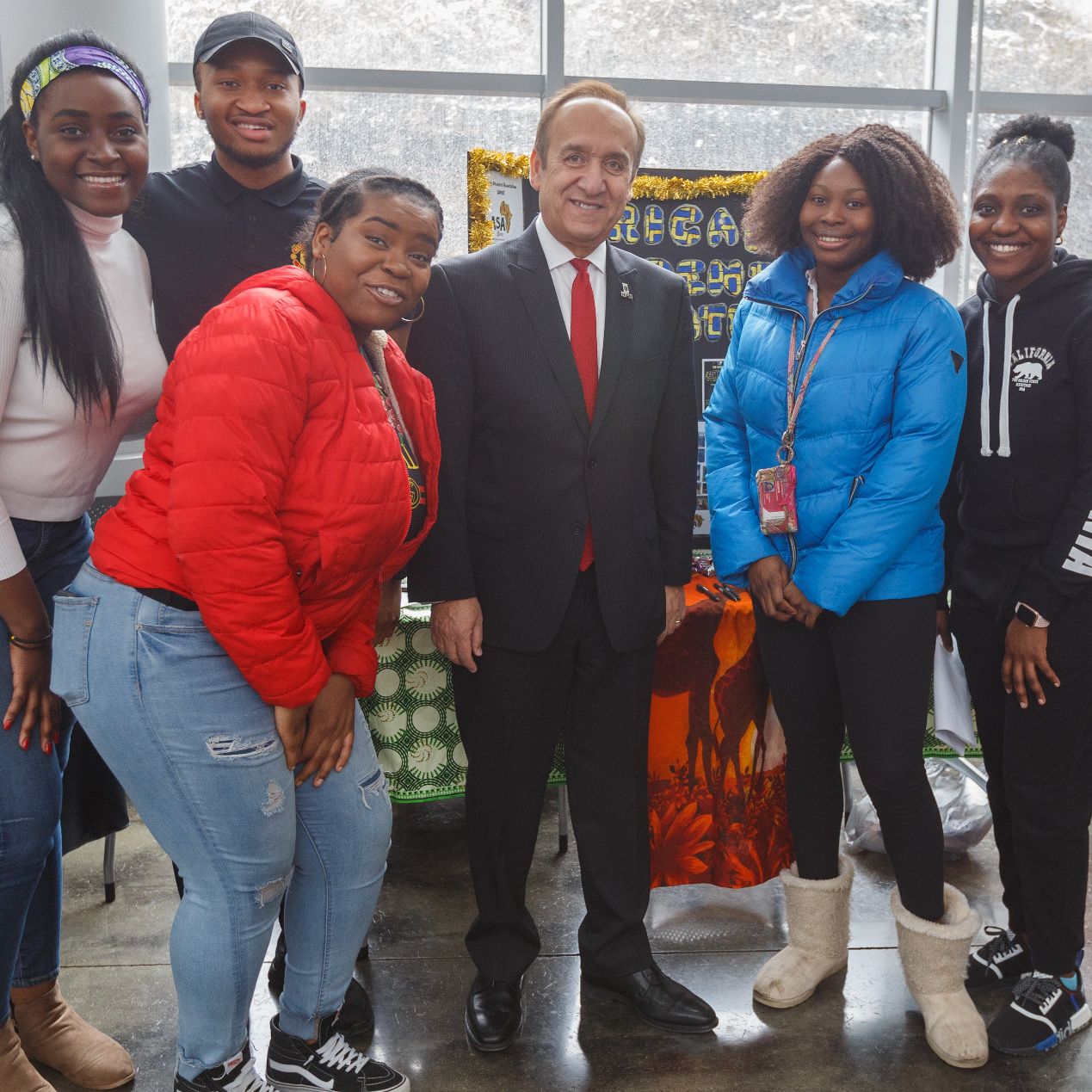 Chancellor Nasser Paydar poses with students