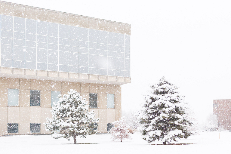IUPUI Library covered in snow during a snow fall.