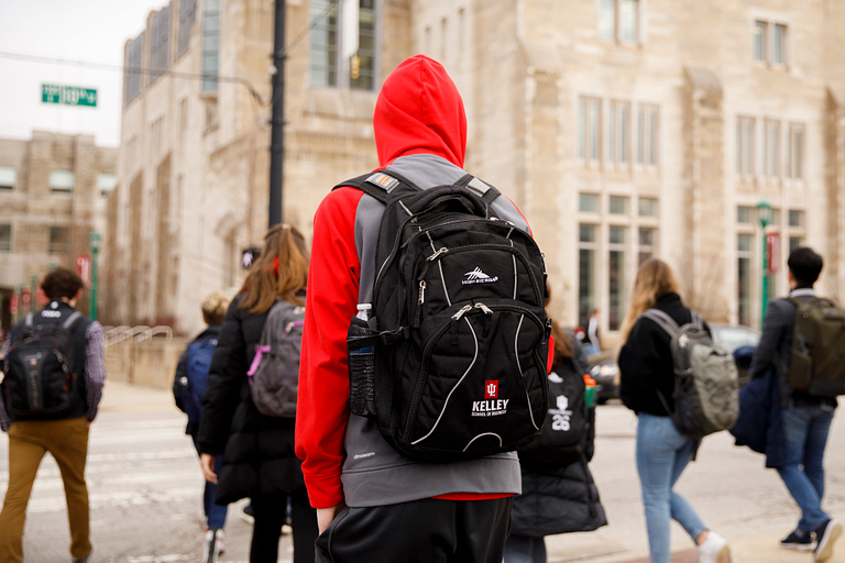 A group of students wait to cross 10th street on the IU Bloomington campus.