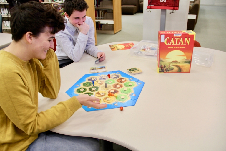 Students play Catan.