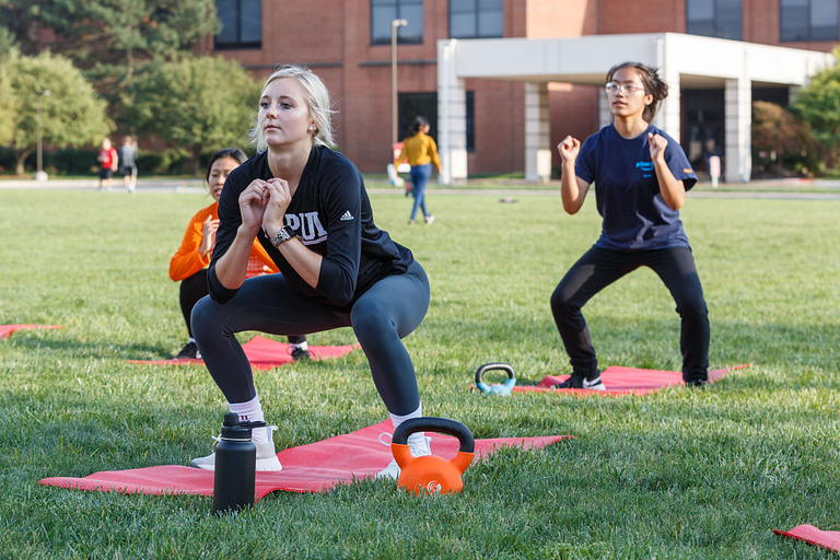 Students participate in fitness class at the Campus Recreation Outdoor Facility at IUPUI.