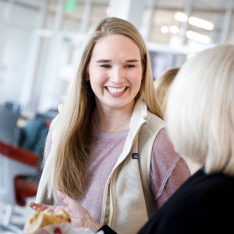 A student interacts with a guest. 