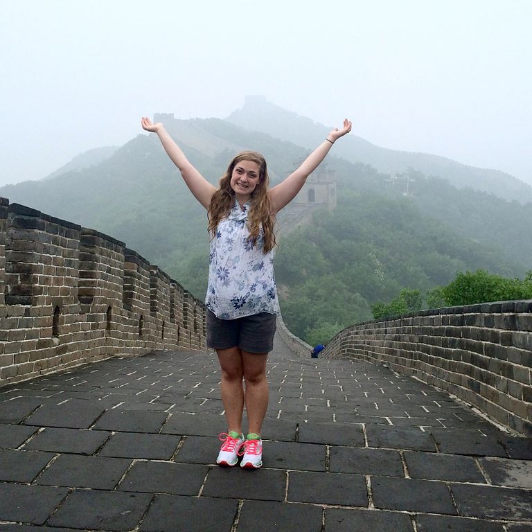 Sarah Grace Fraser stands on the Great Wall of China.