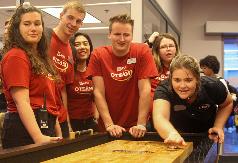 OTEAM leaders welcome new students with a game of shuffleboard