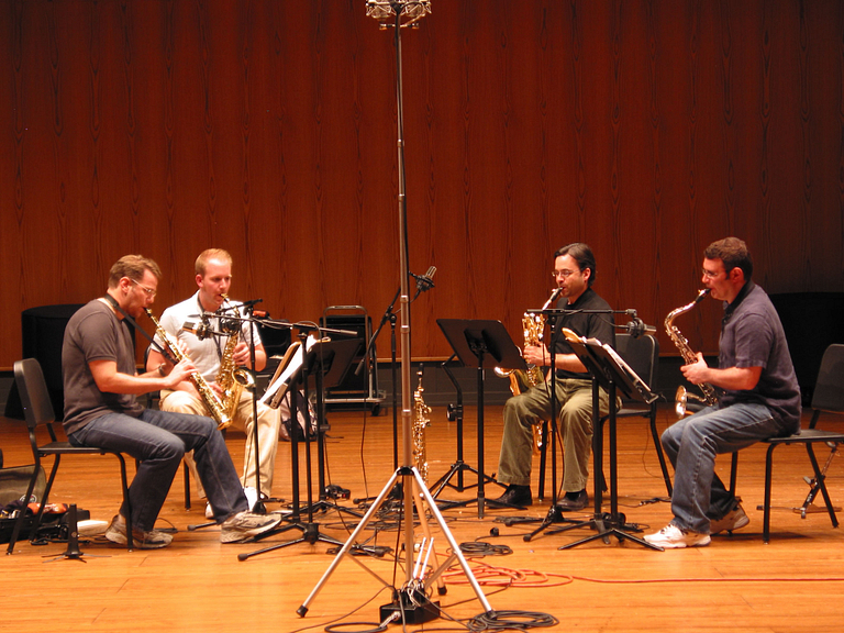 A quartet plays on stage at the Ogle Center