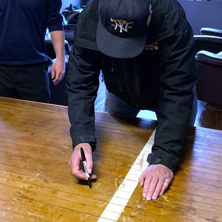 Bob Knight signing the table