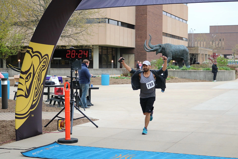 A runner crossing the finish line