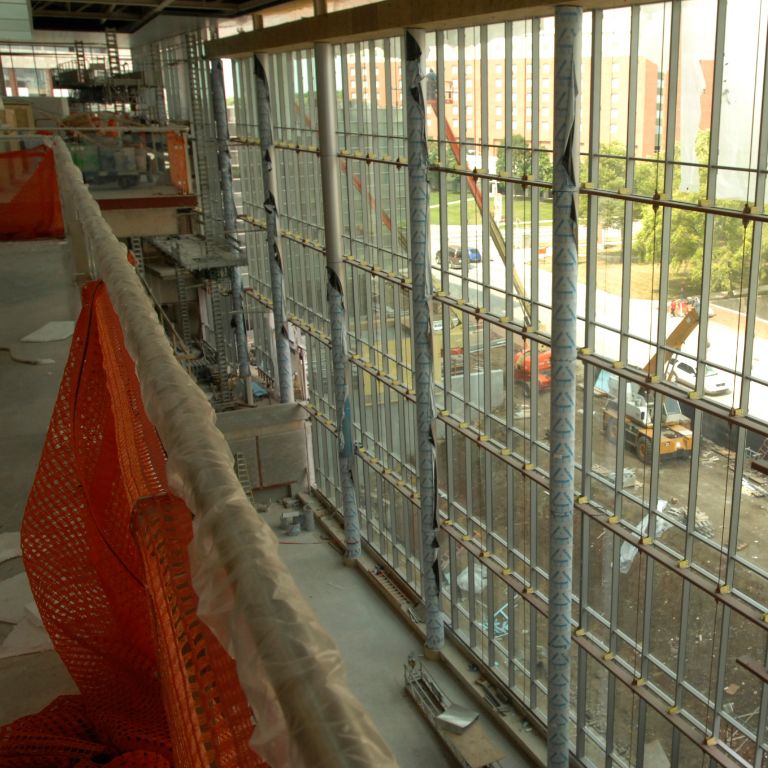 A view of the windows in the Campus Center during construction of the building.