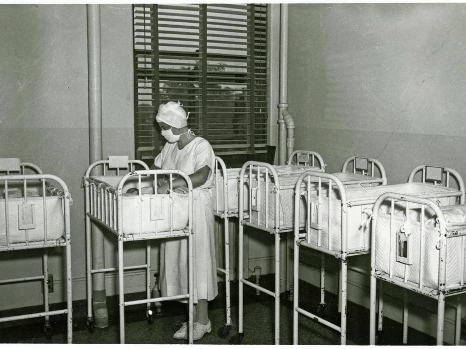 A black and white photo of a nurse in Coleman Hospital