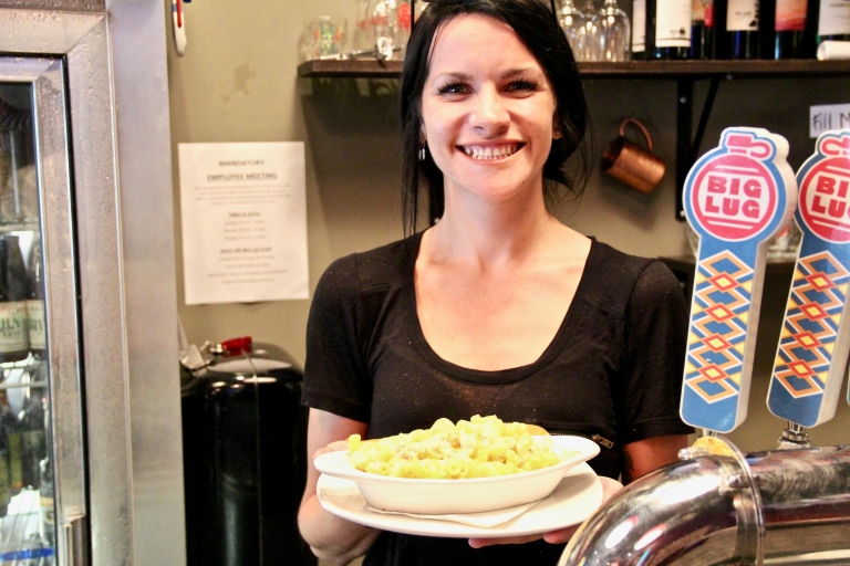 Rockstone bartender Maddy Picco holds an order of Four Cheese al Forno pasta
