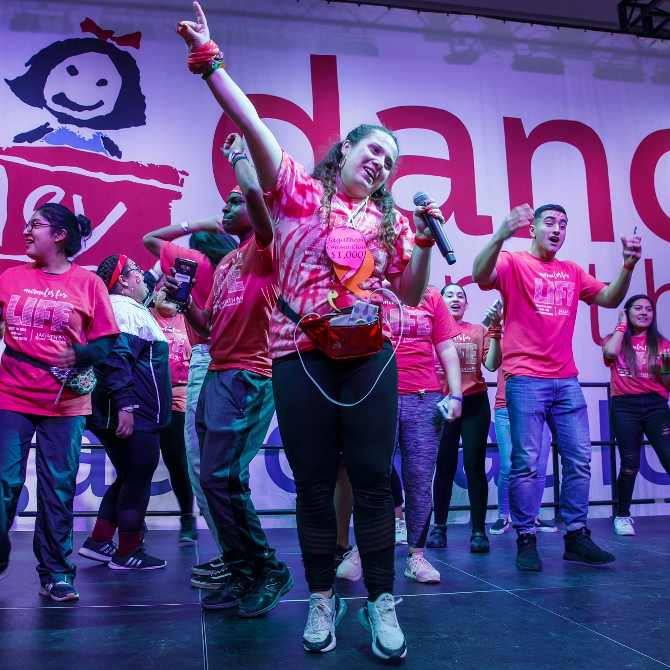 students stand onstage dancing for Jagathon