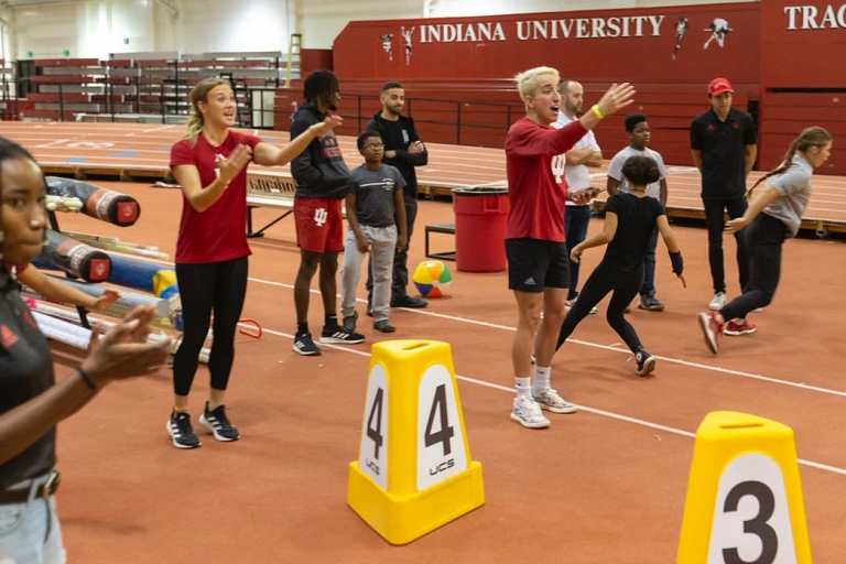 Students and children plat at Indiana University's track and field venue