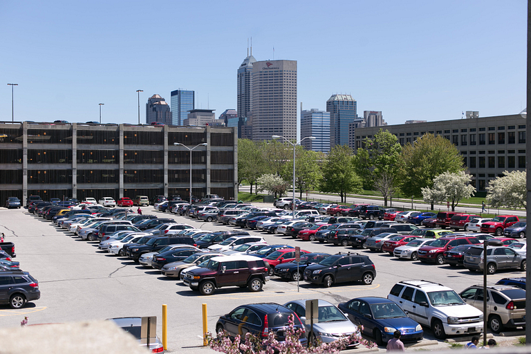 Parking lot with cars in it.