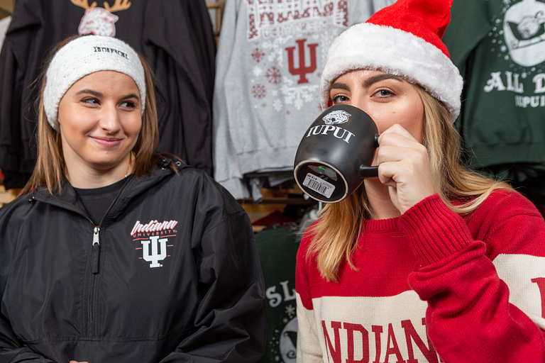 Nursing sophomore Alexis Taylor drinks out of an IUPUI mug.