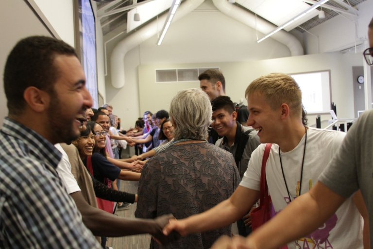 Fulbright Foreign Students shake hands in a networking exercise