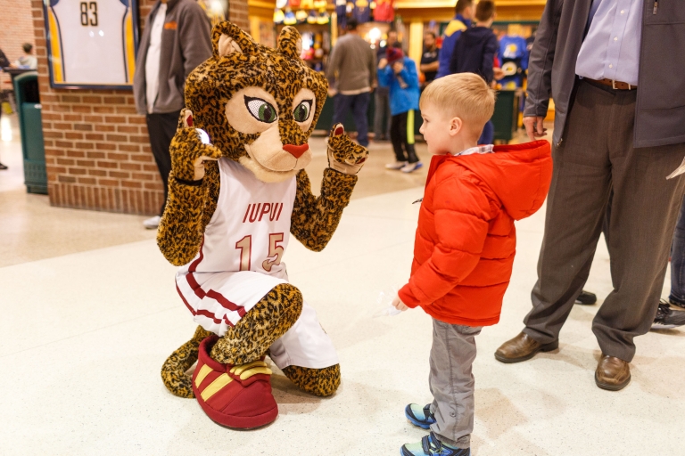 Jazzy meets a young fan at IUPUI Night at the Pacers