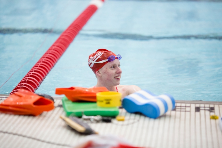 IU swimmer Lilly King smiles in pool.