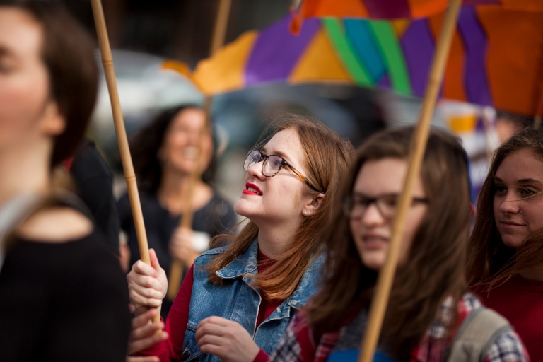 Students carry flags as they walk to vote in the fall of 2016