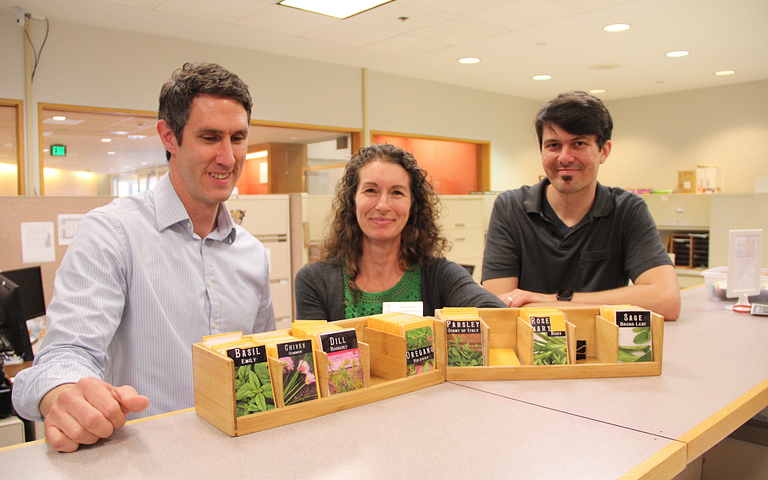 Librarians pose with seed library.