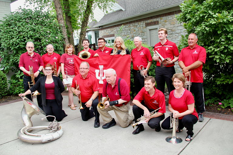 Susannah Buhner poses with members of the Marching Hundred.