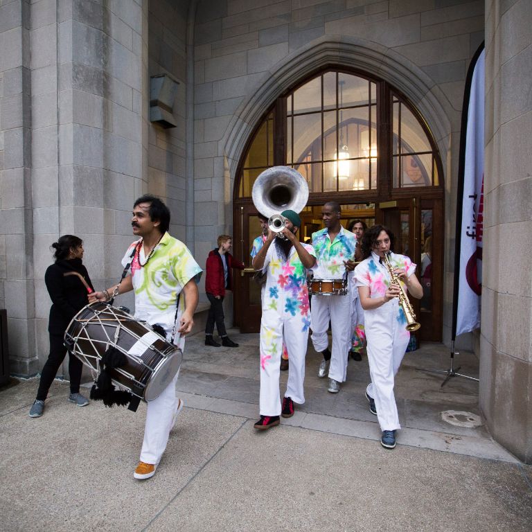 Red Baraat plays music on the balcony of the IMU