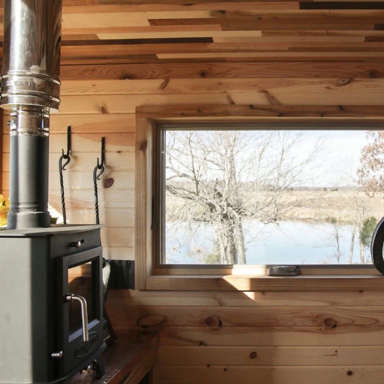 A wood stove in a tiny house