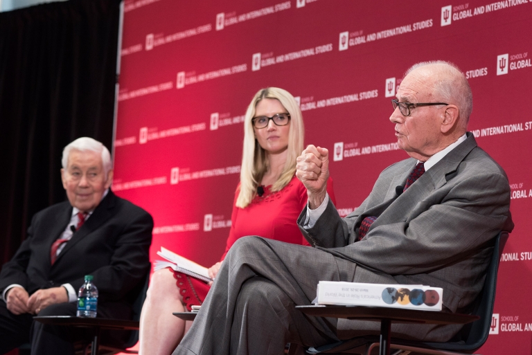 Richard Lugar, Marie Harf and Lee Hamilton, from left, sit on stage
