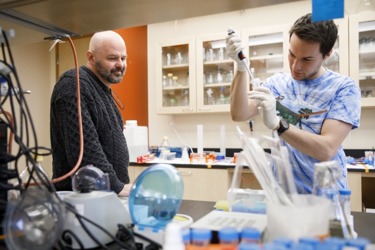 Dan Tracey, left, and Jeremy Davis working in the lab. 