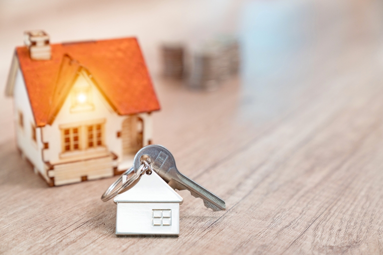 House key on a house-shaped keychain