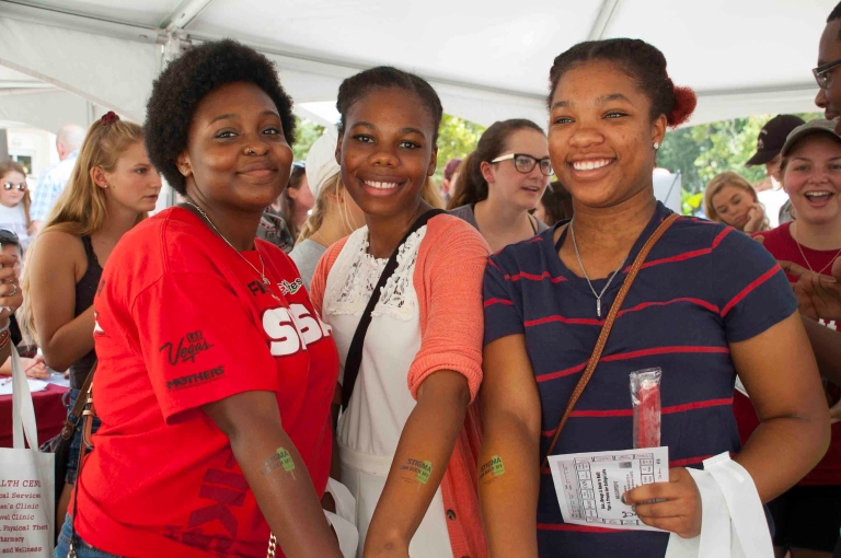 Freshman students showing off temporary tattoos with anti-stigma slogans