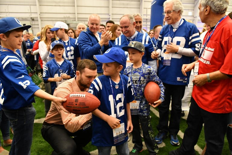 Indianapolis Colts player Andrew Luck signs a jersey at the Chuckstrong gala on April 21