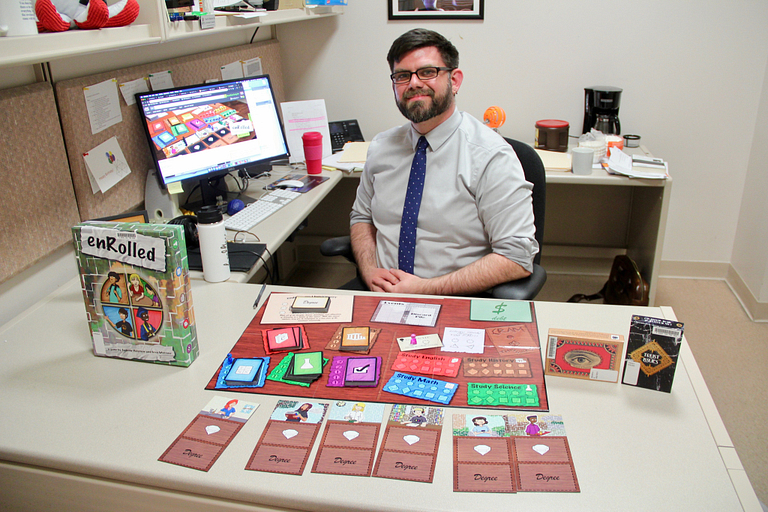 Gary Maixner poses with the games he made