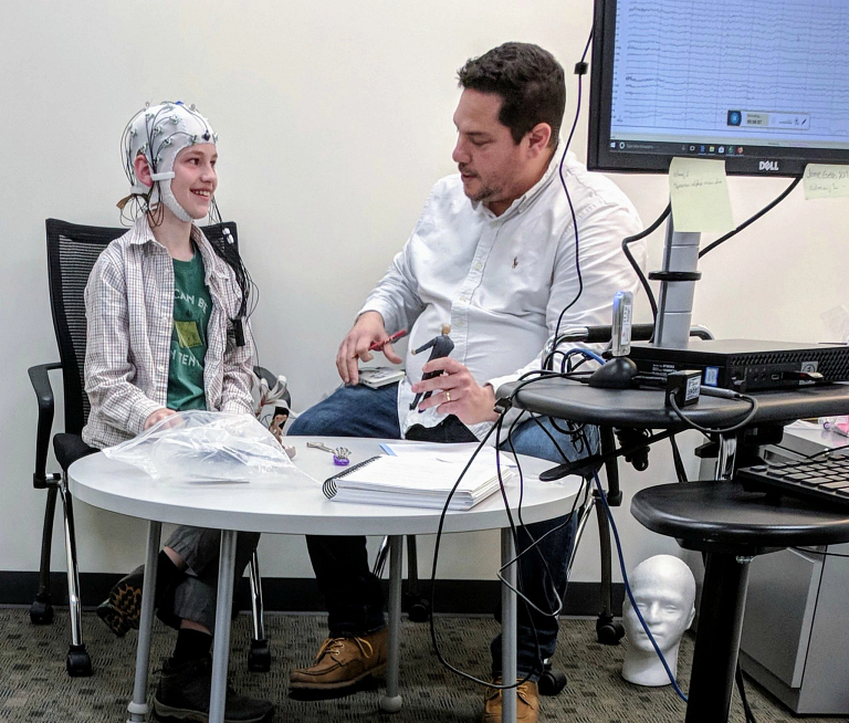Researchers conducting an electroencephalography study