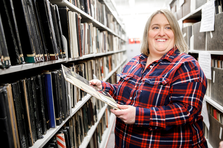 Michelle Hahn holds a record in the William and Gayle Cook Music Library.